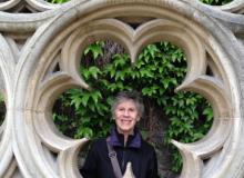 Marilyn Hill in the garden near the entrance to Hôtel de Sully, which is near Place des Vosges in Paris. Photo by Linda Hill