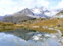 Reflections (including Al and Emily Moore’s) in Leisee Lake at Sunnegga. Photo by Ken Sanner