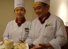 Nguyen Thu Nhi (left) and Chef Nguyen Thanh Ngoan (right) with finished Vietnamese Rice Cakes — Parkroyal Saigon. Photos by Sandra Scott